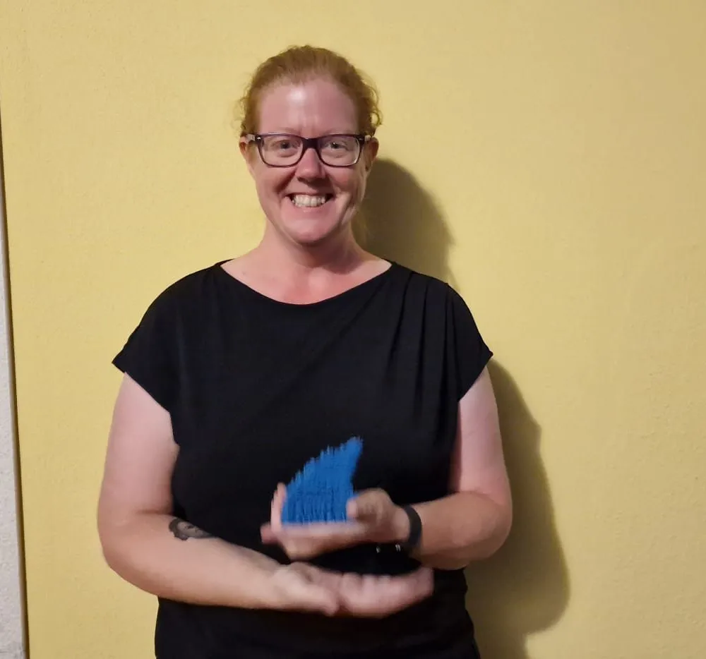woman posing with award