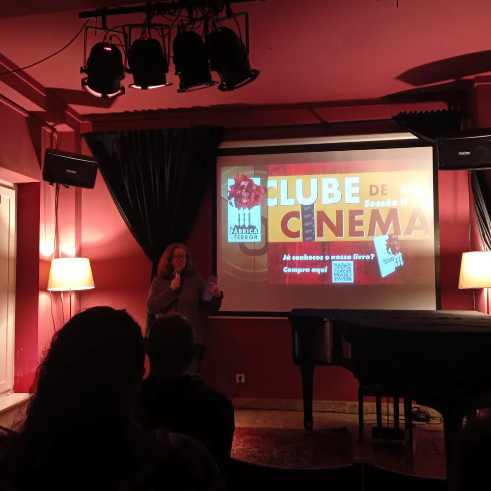 woman in a red room presenting something