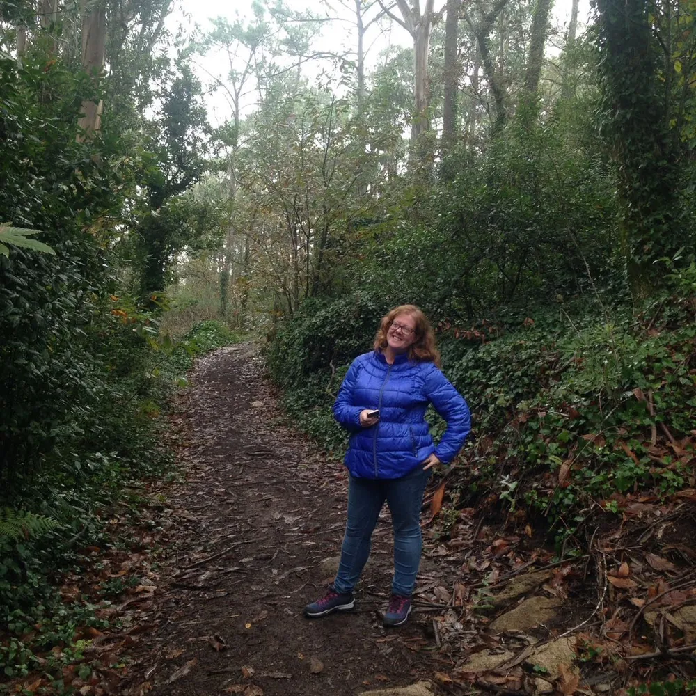 red hair woman in the woods